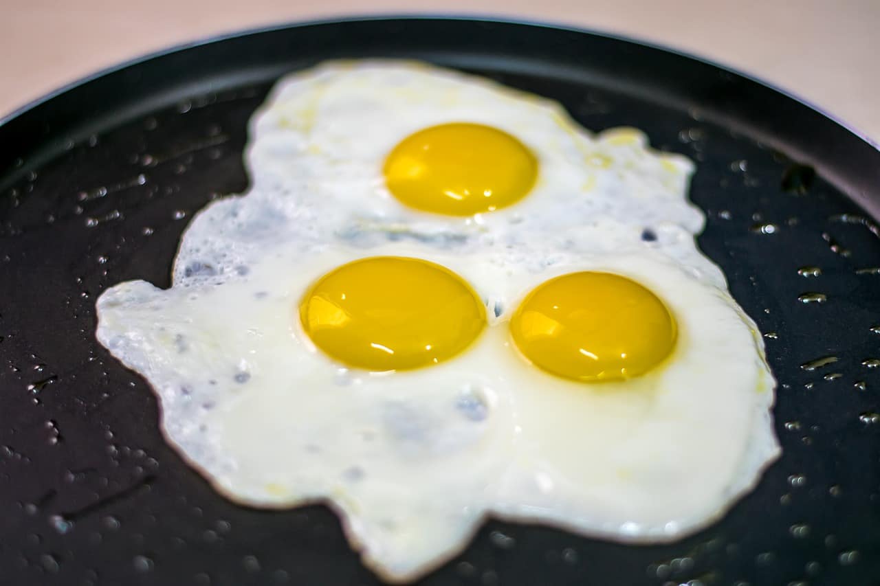 sunny side up eggs on a pan