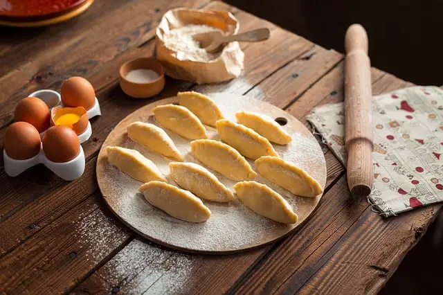 Pies with raw egg ready to cook